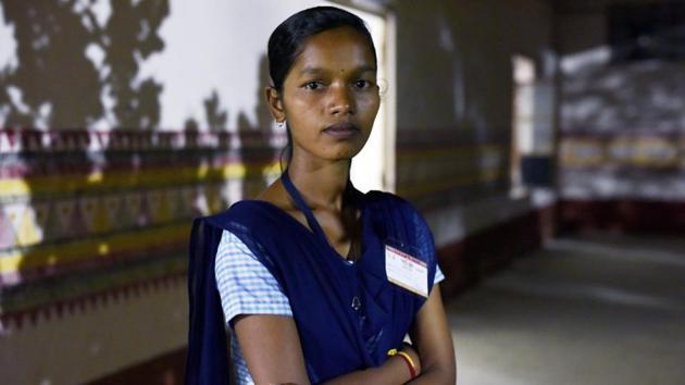 Purnima Haika, a student of science in Eklavya Model Residential School at Rayagada, was the topper among the 14 girls this year, scoring 77%. The story of these girls crossing a milestone has boosted confidence in education and is helping other girls dream big. (Vipin Kumar / HT Photo) 