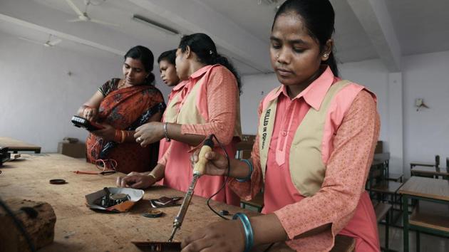 Subarna Jakesika (R) from Kurli village is one of five girls enrolled at ITI Rayagada. Though she scored 43% marks, her parents wanted her to pursue higher studies. Helped by teachers, she managed to get admission and six months later, she is now studying electronics and mechanics. (Vipin Kumar / HT Photo) 