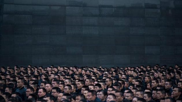 People participate in a ceremony at the Nanjing Massacre Memorial Hall on the second annual national day of remembrance to commemorate the 80th anniversary of the massacre in Nanjing on December 13, 2017. (Chandan Khanna / AFP) People participate in a ceremony at the Nanjing Massacre Memorial Hall on the second annual national day of remembrance to commemorate the 80th anniversary of the massacre in Nanjing on December 13, 2017. (Chandan Khanna / AFP)
