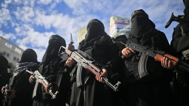 Armed female members of the militant Palestinian group Islamic Jihad carry Kalashnikov assault rifles as they take part in a rally to protest against US President Donald Trump's decision to recognise Jerusalem as the capital of Israel, in Gaza City on December 11, 2017. (Mohammed Abed / AFP) Armed female members of the militant Palestinian group Islamic Jihad carry Kalashnikov assault rifles as they take part in a rally to protest against US President Donald Trump's decision to recognise Jerusalem as the capital of Israel, in Gaza City on December 11, 2017. (Mohammed Abed / AFP)