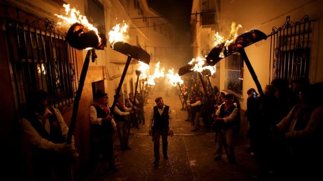 Villagers hold torches to represent light and vision during the Divina Pastora procession, as part of a festival to honour the Virgin of Los Rondeles, on the eve of St Lucia's Day in Casarabonela, Spain on December 12, 2017. (Jon Nazca / REUTERS) Villagers hold torches to represent light and vision during the Divina Pastora procession, as part of a festival to honour the Virgin of Los Rondeles, on the eve of St Lucia's Day in Casarabonela, Spain on December 12, 2017. (Jon Nazca / REUTERS)