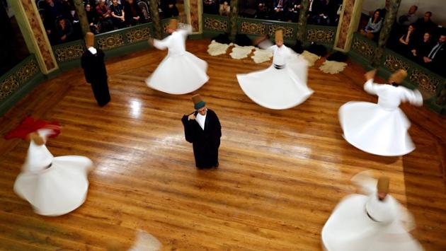 Whirling dervishes perform a "Sema" ritual during a ceremony, marking the 744th anniversary of the death of Mevlana Jalaluddin Rumi, at Galata Mevlevi Temple in Istanbul, Turkey on December 12, 2017. (Murad Sezer / REUTERS) Whirling dervishes perform a "Sema" ritual during a ceremony, marking the 744th anniversary of the death of Mevlana Jalaluddin Rumi, at Galata Mevlevi Temple in Istanbul, Turkey on December 12, 2017. (Murad Sezer / REUTERS)