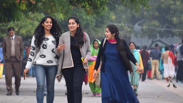 A group of girls taking a stroll at the lake on a cold afternoon in Chandigarh. (Sikander Singh/HT)