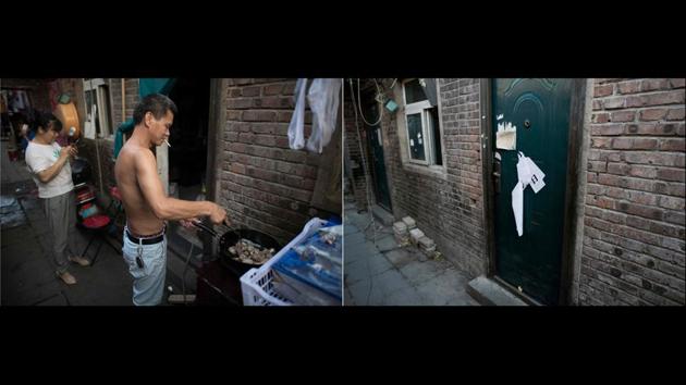 The narrow alleyways of the Beijing migrant neighborhood were once crammed with men cooking on outdoor stoves, women hanging clothes to dry and young children playing games. Now dead leaves litter the pavement as bitterly cold wind blows through empty lanes after a controversial city-wide eviction campaign. (Nicolas Asfouri / AFP)