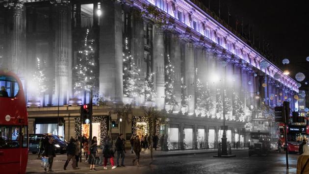 Selfridges around Christmas in 1935 is digitally overlayed with a photo of the same location in 2017. The Selfridges Department Store on Oxford Street is known for its Christmas light decorations, a tradition that is still observed by the store. (Chris J Ratcliffe /Getty Images) Selfridges around Christmas in 1935 is digitally overlayed with a photo of the same location in 2017. The Selfridges Department Store on Oxford Street is known for its Christmas light decorations, a tradition that is still observed by the store. (Chris J Ratcliffe /Getty Images)