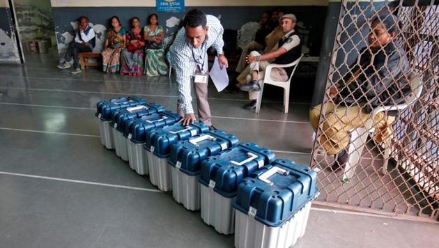 A polling official checks serial numbers on Voter Verifiable Paper Audit Trail (VVPAT) machines at a distribution centre ahead of the second phase of voting in Gujarat assembly election in Ahmedabad, on December 13, 2017. (REUTERS) A polling official checks serial numbers on Voter Verifiable Paper Audit Trail (VVPAT) machines at a distribution centre ahead of the second phase of voting in Gujarat assembly election in Ahmedabad, on December 13, 2017. (REUTERS)