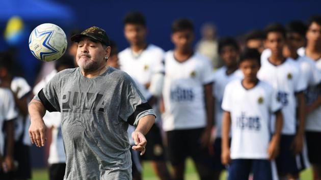 Argentinian football legend Diego Maradona shows his skills during a football workshop at Barasat in North 24 Parganas on Tuesday. (Ashok Bhaumik / PTI) 
