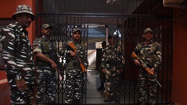 Paramilitary soldiers stand guard outside a gate leading to a room containing Electronic Voting Machines in Ahmedabad on December 15, 2017, a day after the second phase of the Gujarat legislative assembly election. (AFP) Paramilitary soldiers stand guard outside a gate leading to a room containing Electronic Voting Machines in Ahmedabad on December 15, 2017, a day after the second phase of the Gujarat legislative assembly election. (AFP)