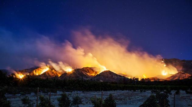 The fire burns along a hillside near Santa Paula, California. The vast landscape charred by the blaze, which is centered less than 161 km northwest of downtown Los Angeles, is approaching the 257,314 acres (104,131 hectares) destroyed by California’s Rim Fire in 2013 --the third-largest blaze on record in the state. (Kyle Grillot / AFP) The fire burns along a hillside near Santa Paula, California. The vast landscape charred by the blaze, which is centered less than 161 km northwest of downtown Los Angeles, is approaching the 257,314 acres (104,131 hectares) destroyed by California’s Rim Fire in 2013 --the third-largest blaze on record in the state. (Kyle Grillot / AFP)