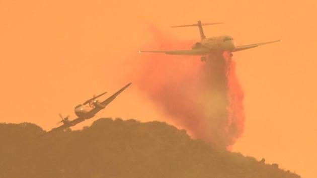 Firefighting tanker airplanes drop retardants on the fire. More than 8,000 firefighters from nearly a dozen states, aided by 32 helicopters and 78 bulldozers have been trying to contain the wildfire. (Santa Barbara County Fire / AFP) Firefighting tanker airplanes drop retardants on the fire. More than 8,000 firefighters from nearly a dozen states, aided by 32 helicopters and 78 bulldozers have been trying to contain the wildfire. (Santa Barbara County Fire / AFP)