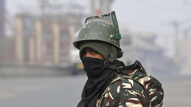 Paramilitary soldier stand guard during restriction in downtown area of Srinagar, November 27, 2017.(HT File Photo)