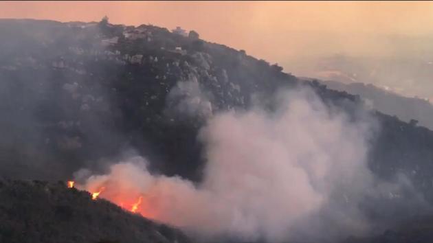 In this image taken from video provided by the Santa Barbara County Fire Department, a wind driven spot fire burns on the west side below Gibraltar Road as smoke from a wildfire fills the air in Santa Barbara, Calif., Saturday, Dec. 16, 2017. (AP) In this image taken from video provided by the Santa Barbara County Fire Department, a wind driven spot fire burns on the west side below Gibraltar Road as smoke from a wildfire fills the air in Santa Barbara, Calif., Saturday, Dec. 16, 2017. (AP)