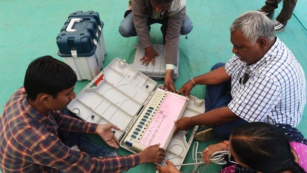 Officials check an Electronic Voting Machine (EVM) ahead of the 2nd phase of Gujarat Vidhan Sabha elections in Ahmedabad on December 13. (AFP Photo) Officials check an Electronic Voting Machine (EVM) ahead of the 2nd phase of Gujarat Vidhan Sabha elections in Ahmedabad on December 13. (AFP Photo)