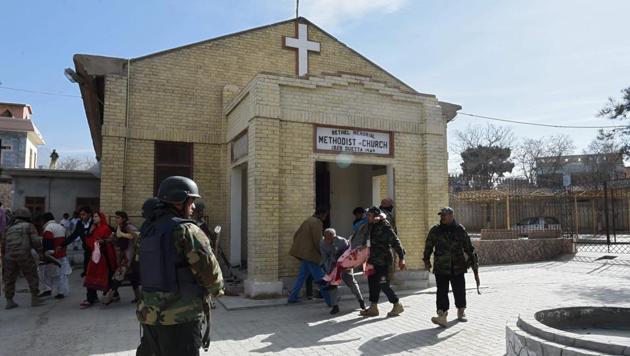 Pakistani security personnel rescue an injured woman after suicide bombers attacked a Methodist Church during a Sunday service in Quetta on December 17 2017.(AFP) Pakistani security personnel rescue an injured woman after suicide bombers attacked a Methodist Church during a Sunday service in Quetta on December 17 2017.(AFP)