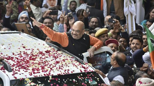 BJP national President Amit Shah greets supporters celebrating the BJP’s assembly election results in Gujarat and Himachal Pradesh at BJP headquarters in New Delhi. As counting of votes for the 182-seat Gujarat assembly progresses after a two-phase election in PM Modi’s home state, trends show the Bharatiya Janata Party set to win albeit with a reduced margin, with the Congress improving its tally this time over. (Sonu Mehta / HT Photo)