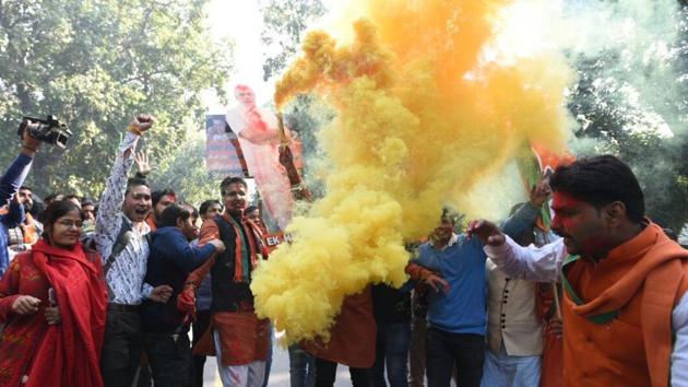 BJP workers celebrate party’s win in Gujarat and Himachal Pradesh assembly elections at BJP headquarters in New Delhi. (Sonu Mehta /  HT Photo) 