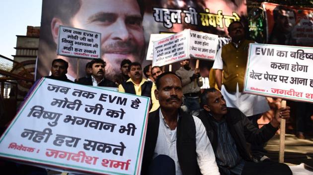 Congress party workers protest against electronic voting machines outside party headquarters in New Delhi. Election Commission however defends EVMs, calling criticism in Gujarat elections unfair. Congress leaders say the party’s improved electoral performance in Gujarat is the result of their new chief Rahul Gandhi’s effective leadership, and is the beginning of his political story. (Burhaan Kinu / HT Photo)