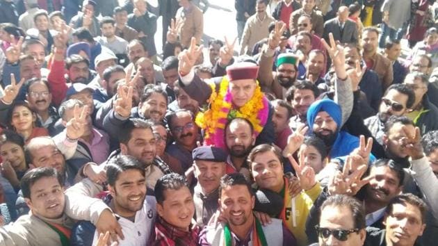  BJP candidate from Shimla, Suresh Bhardwaj, celebrates his victory with supporters in Himachal Pradesh. Counting of votes began at 8am in the hill state that witnessed a record 75.28% turnout. Election Commission officially declared the first seat in Himachal Pradesh elections 2017 for Congress candidate Anirudh Singh from the Kasumpti constituency. Singh defeated Vijay Jyoti by a margin of 9,397 votes. (Deepak Sansta / HT Photo) 
