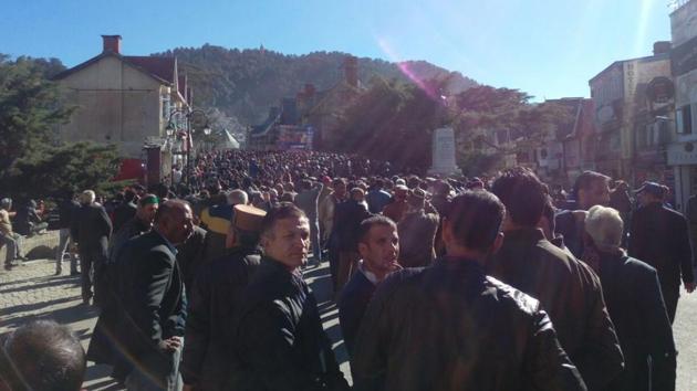 A large crowd gathered at the Mall Road, where a large screen displaying poll results has been put up. (Deepak Sansta/HT Photo)