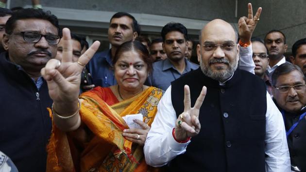 BJP president Amit Shah (R) after voting in the second phase of Gujarat state assembly elections in Ahmedabad on December 14, 2017. Early trends are contrary to the BJP’s ‘mission 150’, based on the momentum it gained in Uttar Pradesh and Uttarakhand. Unlike last election, there were no fireworks in the morning, as BJP workers held back celebrations. BJP chief Amit Shah is expected to reach the party headquarters around noon. (Ajit Solanki / AP)