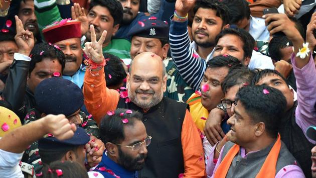 BJP president Amit Shah flashes victory sign on his arrival at the party office in New Delhi, after winning assembly elections in Gujarat and Himachal Pradesh. (PTI Photo) BJP president Amit Shah flashes victory sign on his arrival at the party office in New Delhi, after winning assembly elections in Gujarat and Himachal Pradesh. (PTI Photo)