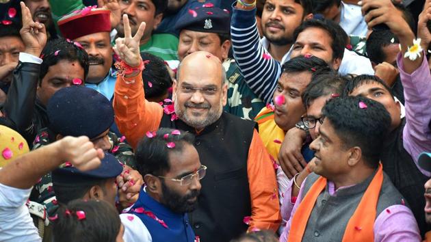 BJP president Amit Shah flashes the victory sign as he arrives at the party headquarters in New Delhi on Monday, after the party's victory in the assembly elections in Gujarat and Himachal Pradesh. (PTI) BJP president Amit Shah flashes the victory sign as he arrives at the party headquarters in New Delhi on Monday, after the party's victory in the assembly elections in Gujarat and Himachal Pradesh. (PTI)
