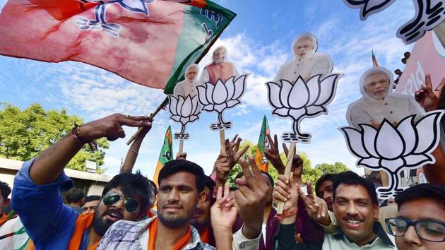 BJP workers celebrate their victory in the assembly elections, at the party office 'Kamlam' in Gandhinagar on Monday. (PTI Photo) BJP workers celebrate their victory in the assembly elections, at the party office 'Kamlam' in Gandhinagar on Monday. (PTI Photo)