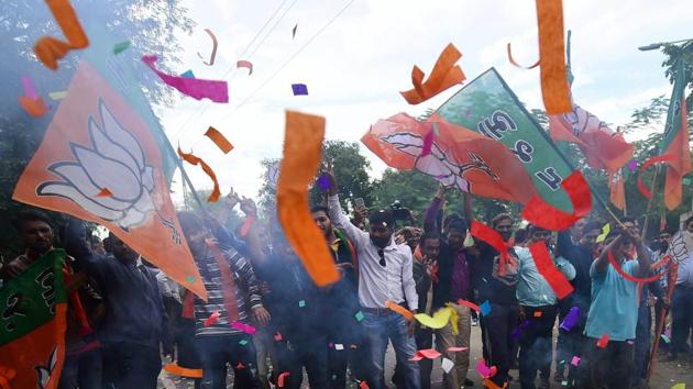 BJP workers burst fire-crackers to celebrate their victory in the Assembly elections, at the party office 'Kamlam' in Gandhinagar on Monday. (PTI) BJP workers burst fire-crackers to celebrate their victory in the Assembly elections, at the party office 'Kamlam' in Gandhinagar on Monday. (PTI)