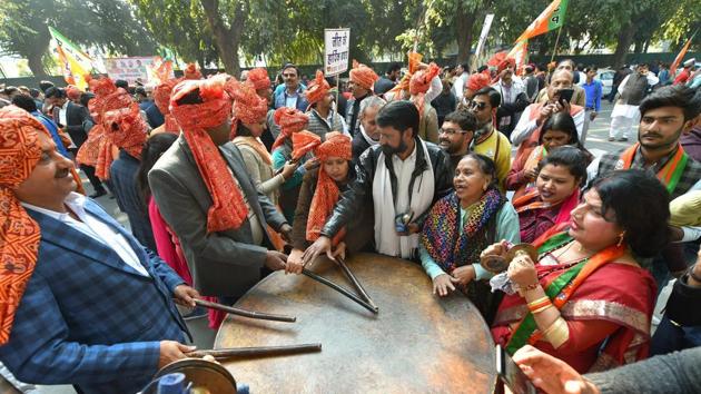 BJP workers and supporters celebrate party’s success in Gujarat and Himachal Pradesh assembly elections, in New Delhi.(PTI Photo)