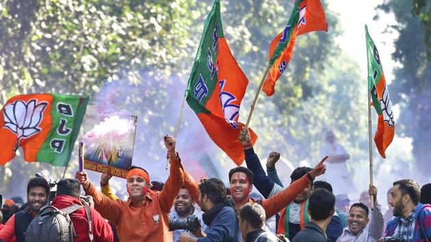 BJP workers celebrate party success in Gujarat and Himachal Pradesh state assembly elections outside the BJP headquarters, in New Delhi, on Monday. (PTI) BJP workers celebrate party success in Gujarat and Himachal Pradesh state assembly elections outside the BJP headquarters, in New Delhi, on Monday. (PTI)