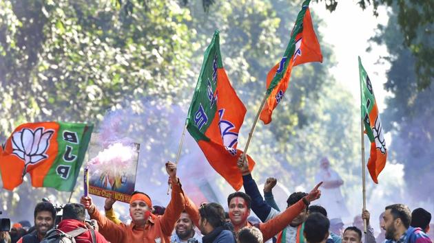 Party workers celebrating BJP's success in the Gujarat and Himachal Pradesh assembly elections outside the BJP headquarter, New Delhi, December 18 (PTI) Party workers celebrating BJP's success in the Gujarat and Himachal Pradesh assembly elections outside the BJP headquarter, New Delhi, December 18 (PTI)