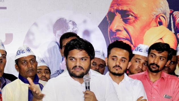 The improved tally for the Congress in North Gujarat showed that the coming together of Hardik Patel (with the mic), OBC leader Alpesh Thakor and Dalit activist Jignesh Mevani helped in moving youth votes away from the BJP.(PTI Photo)