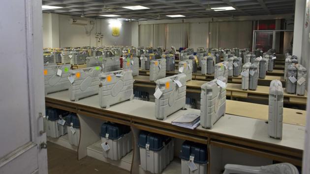 Cases containing EVMs sit in a high security room before vote counting. The Chief Election Commissioner AK Jyoti assured there can be no tampering of EVMs, “Questions being raised about EVMs have already been answered by us in the media. VVPATs were there in every polling stations in Gujarat, which enabled voters to see whom they voted for, so issues being raised aren’t right. I assure that EVMS cannot be tampered with.” (Ashwini Bhatia / AP) 