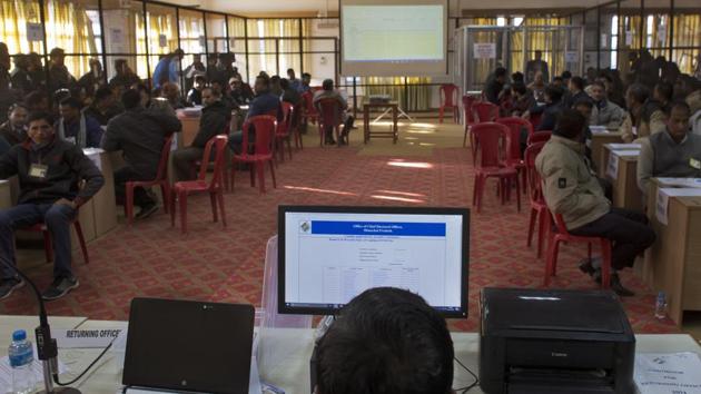 An election official operates a computer for vote counting at a poll counting center in Dharmsala on Monday. There are 68 seats in the Himachal Pradesh assembly and a party needs 35 seats to be able to form a government. (Ashwini Bhatia / AP) 