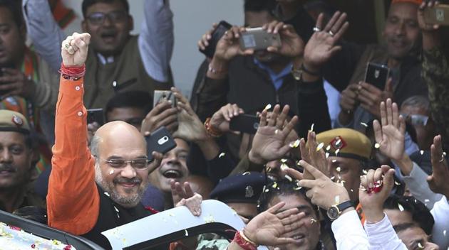 BJP president Amit Shah raises his fist in celebration as he arrives at the party headquarters in New Delhi, on Monday. The party won in both the Gujarat and Himachal Pradesh assembly elections. (AP Photo) BJP president Amit Shah raises his fist in celebration as he arrives at the party headquarters in New Delhi, on Monday. The party won in both the Gujarat and Himachal Pradesh assembly elections. (AP Photo)