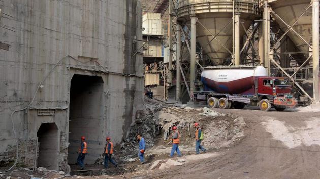 Pakistani and Chinese workers walk into the site of the project in Nosari. As a tributary of the Jhelum River, the Neelum theoretically falls into Pakistan’s sphere, which launched the Neelum-Jhelum power plant project a quarter of a century ago to counter the legal, but competing Kishanganga project in Indian Kashmir. (Sajjad Qayyum / AFP)