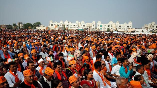 Supporters of Bharatiya Janata Party attend a campaign meeting addressed by Prime Minister Narendra Modi ahead of Gujarat state assembly election in Kalol, on December 8.(File)