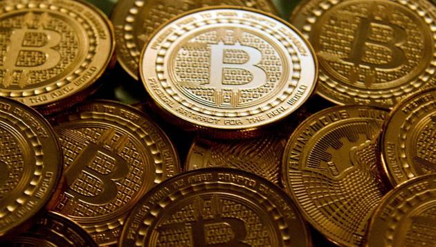 This file photo taken in Washington, DC, on May 1, 2014 shows bitcoin medals. (AFP) This file photo taken in Washington, DC, on May 1, 2014 shows bitcoin medals. (AFP)