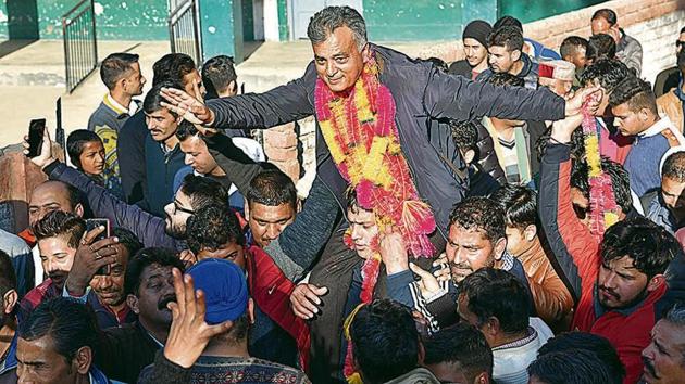 Anil Sharma, who switched from the Congress to the BJP just before the elections, celebrating his win with supporters in Mandi on Monday. (Birbal Sharma/HT) Anil Sharma, who switched from the Congress to the BJP just before the elections, celebrating his win with supporters in Mandi on Monday. (Birbal Sharma/HT)