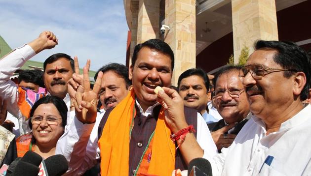 Chief minister Devendra Fadnavis celebrates BJP’s victory in Gujarat and Himachal Pradesh with other party members outside Vidhan Bhavan in Nagpur on Monday. (Sunny Shende) Chief minister Devendra Fadnavis celebrates BJP’s victory in Gujarat and Himachal Pradesh with other party members outside Vidhan Bhavan in Nagpur on Monday. (Sunny Shende)