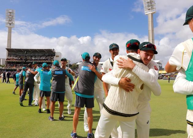 Australia cricket team players celebrate as as they walk off the ground after beating England cricket team in the third Ashes Test in Perth on Monday. (REUTERS) Australia cricket team players celebrate as as they walk off the ground after beating England cricket team in the third Ashes Test in Perth on Monday. (REUTERS)