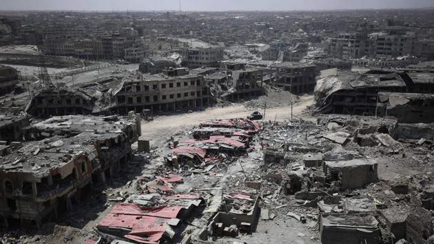 This file photo taken on July 09, 2017 shows a general view of the destruction in Mosul's Old City. 2017 will be remembered as the year the Islamic State organisation's ultra-violent experiment in statehood was terminated but Iraq and Syria are left staring at ruined cities and daunting challenges. War-torn Syria remains the most dangerous country in the world for journalists. (AFP) This file photo taken on July 09, 2017 shows a general view of the destruction in Mosul's Old City. 2017 will be remembered as the year the Islamic State organisation's ultra-violent experiment in statehood was terminated but Iraq and Syria are left staring at ruined cities and daunting challenges. War-torn Syria remains the most dangerous country in the world for journalists. (AFP)