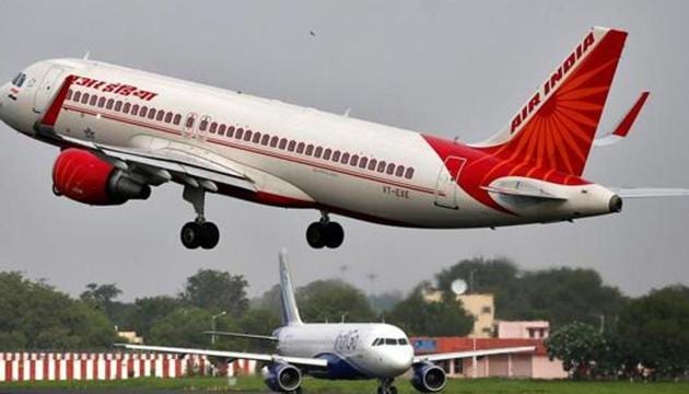 An Air India aircraft takes off as an IndiGo Airlines aircraft waits for clearance at the Sardar Vallabhbhai Patel International Airport in Ahmedabad on July 7. (REUTERS) An Air India aircraft takes off as an IndiGo Airlines aircraft waits for clearance at the Sardar Vallabhbhai Patel International Airport in Ahmedabad on July 7. (REUTERS)