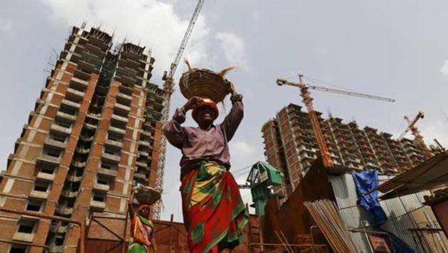 Labourers work at the construction site in Noida. The federal think tank is of the opinion that instead of capital subsidy for businesses, there is a need for labour subsidy now.(Reuters File Photo)