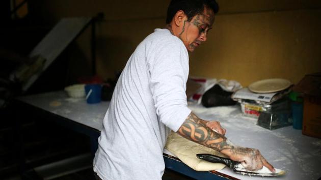 Roberto Renderos, portions out dough at their bakery in San Salvador. “I’ve only had losses being part of the gang,” Gomez said. “I haven’t won anything. I lost my youth, which was spent in jail. I lost my family due to my bad decisions...and I lost the best years of my life due to a pointless ideology.” “Now, my fun, my enjoyment, is to see them smile, to have dreams,” he added. (Jose Cabezas / REUTERS) 
