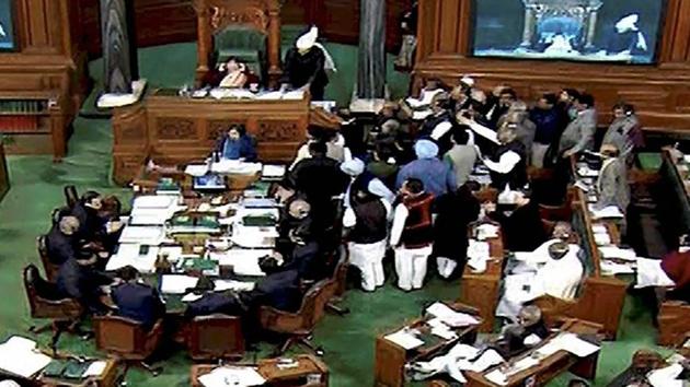 Opposition members protesting in the well of the Lok Sabha in New Delhi on Tuesday.(PTI file photo) Opposition members protesting in the well of the Lok Sabha in New Delhi on Tuesday.(PTI file photo)