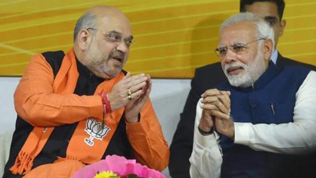 Prime Minister Narendra Modi and BJP president Amit Shah before the party's parliamentary board meeting in New Delhi on Monday, after the party's win in Gujarat and Himachal Pradesh Assembly elections. The party leaders discussed possible CM candidates for the two states at the meeting. (PTI Photo) Prime Minister Narendra Modi and BJP president Amit Shah before the party's parliamentary board meeting in New Delhi on Monday, after the party's win in Gujarat and Himachal Pradesh Assembly elections. The party leaders discussed possible CM candidates for the two states at the meeting. (PTI Photo)