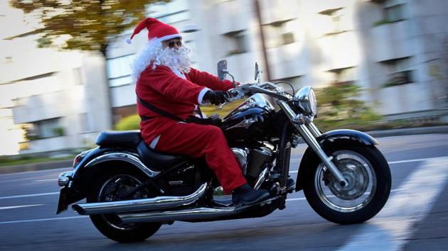Santa takes his cruiser out for a spin during the "Papanoelada" event in Vigo, Spain. (Miguel Riopa / AFP)
