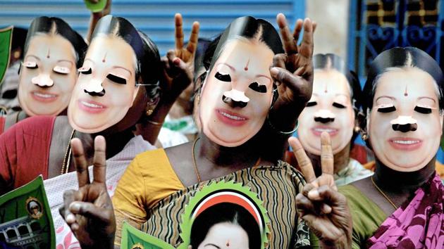 AIADMK supporters wearing masks embossed with the image of late chief minister J Jayalalithaa while seeking votes for party candidate E Madusudanan at RK Nagar constituency on Monday.(PTI Photo) AIADMK supporters wearing masks embossed with the image of late chief minister J Jayalalithaa while seeking votes for party candidate E Madusudanan at RK Nagar constituency on Monday.(PTI Photo)