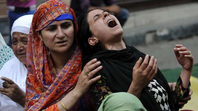 A relative of Irfan Ahmed, who was killed by a tear-gas shell, cries as residents visit the family to offer their condolences in the downtown area of Srinagar last August. Teenager Irfan Ahmed was killed after he was hit in the chest by a tear-gas canister fired by security forces to quell pro-freedom protests in Srinagar. (Waseem Andrabi / HT Photo) A relative of Irfan Ahmed, who was killed by a tear-gas shell, cries as residents visit the family to offer their condolences in the downtown area of Srinagar last August. Teenager Irfan Ahmed was killed after he was hit in the chest by a tear-gas canister fired by security forces to quell pro-freedom protests in Srinagar. (Waseem Andrabi / HT Photo)
